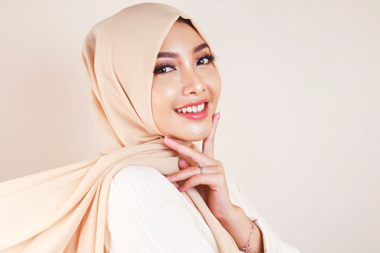 Young woman with smooth radiant skin after anti-aging treatment in Malaysia